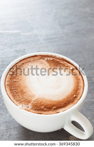 Coffee cup on grey background, stock photo