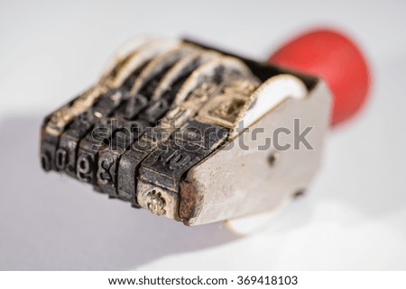 An old stamper on a white background