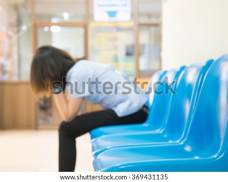 Blurred Patients In Doctors Waiting Room Royalty-Free Stock Photo #369431135