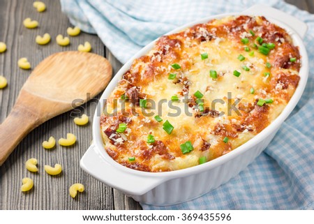 Bacon lovers' mac and cheese in baking dish Royalty-Free Stock Photo #369435596