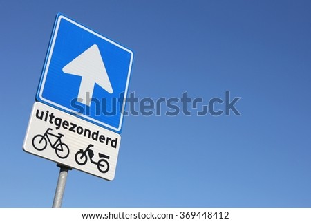 Dutch road sign: one-way street (translation: except)