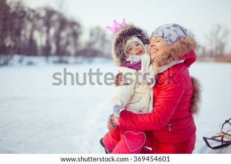 Adorable young mother with her daughter 