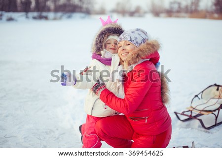 Adorable young mother with her daughter 