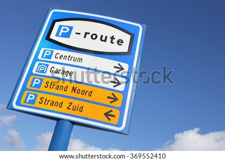 Dutch road sign: parking route (translation of the yellow highlighted text: northern beach, southern beach)