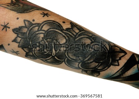 Flower tattoo on male forearm over white background