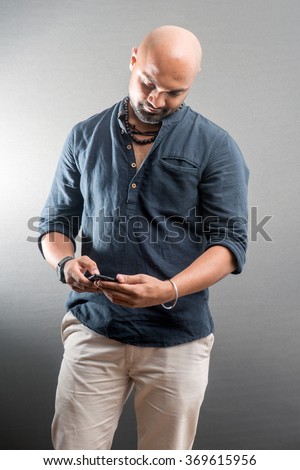 Indian young man on cell phone, Mumbai, Maharashtra, India, Southeast Asia