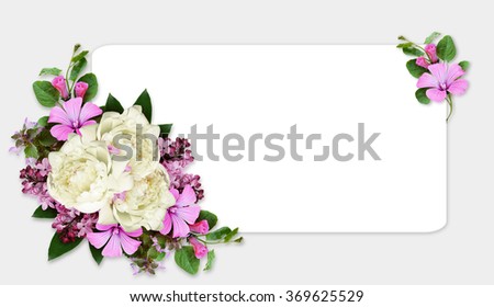 Peony and wild flowers composition in a corner of card on gray background