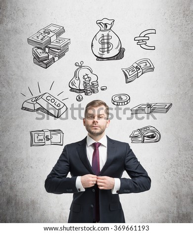 young man buttoning up his suit and looking in front, black pictures symbolizing money over his head. Concrete background. Front view. Concept of running into money.