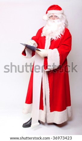 Traditional Santa Claus writing christmas roll