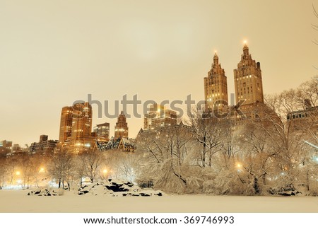 Central Park winter at night with skyscrapers in midtown Manhattan New York City