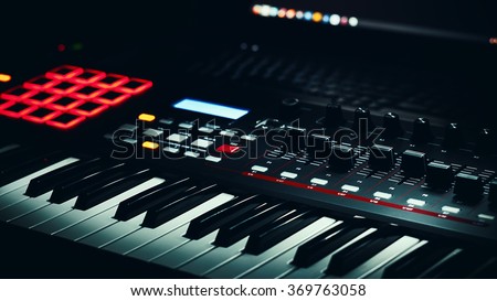 Details of a modern keyboard midi controller.  Royalty-Free Stock Photo #369763058