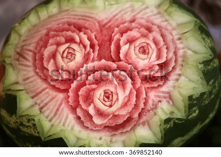 Beautiful roses cut from tasty ripe sweet bright red watermelon berry cute delicious dessert rich for vitamins and minerals food art natural decoration closeup, horizontal picture