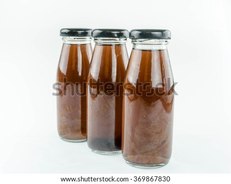 berry mix juice in a bottle on a white background.