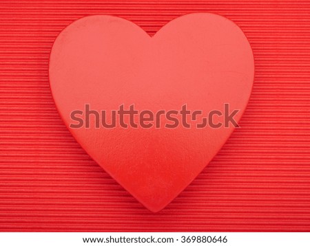 Valentines Day - Red heart on crepe paper background.