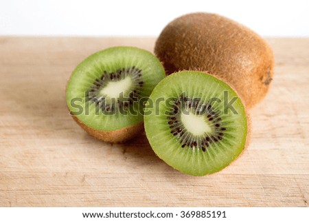 Kiwifruit on wood background