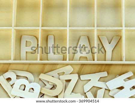 Word play made with wooden letters alphabet