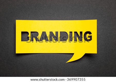 Bubble speech with cut out phrase "branding" in the paper. Royalty-Free Stock Photo #369907355