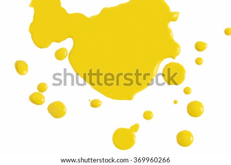 Yellow paint drops isolated on white background