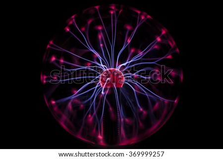 Plasma ball rays in the dark Royalty-Free Stock Photo #369999257