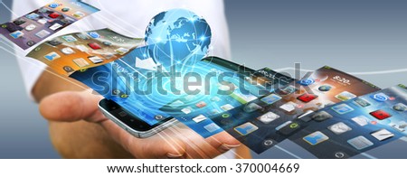 Businessman with modern mobile phone in his hand switching pictures