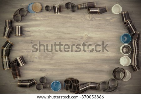  Old film with case on Wooden background 