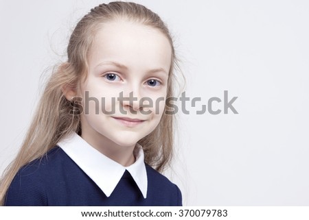 Friendly and Beautiful Caucasian Blond Girl with Wonderful Deep Eyes. Positive Facial Expression. Posing Against White. Horizontal Image Composition
