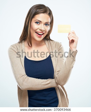 Smiling woman casual style dressed holding credit card. White background isolated portrait.