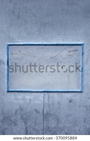 A blank blue metal signage frame.

