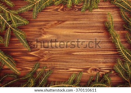 Decorated pine branches  on wooden table free space