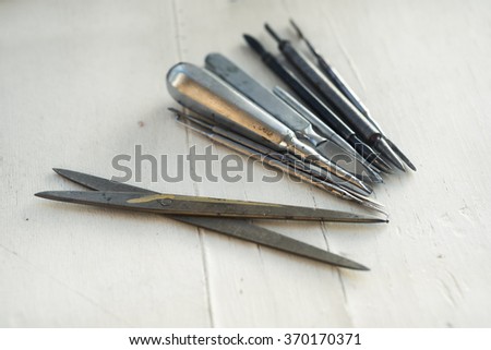 Painter sculpture printing tool set on white wooden background. 