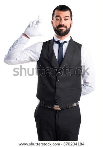 Luxury waiter with his fingers crossing