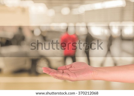 image of hand open up and blur technician fixing car in the garage.