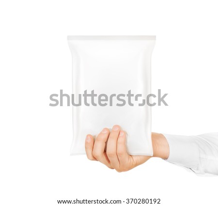 Blank white snack bag mock up hold in hand isolated. Clear white chips pack mockup. Cookie, candy, sugar, cracker, nuts, jujube supermarket foil plastic package ready for logo design presentation.