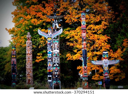 Totem poles in Stanley Park,Vancouver Royalty-Free Stock Photo #370294151