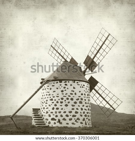 textured old paper background with windmills of Fuerteventura