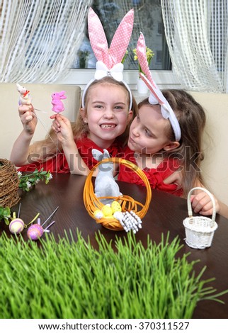 two happy girls are preparing themselves for Easter