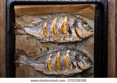 Delicious roasted sea fish. Healthy food, diet or cooking concept
