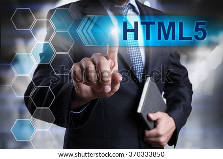 Businessman pressing button on touch screen interface and select "HTML5". Business concept. Internet concept.