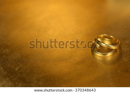 Gold rings on gold background