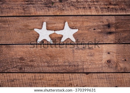 white stars on a wooden background