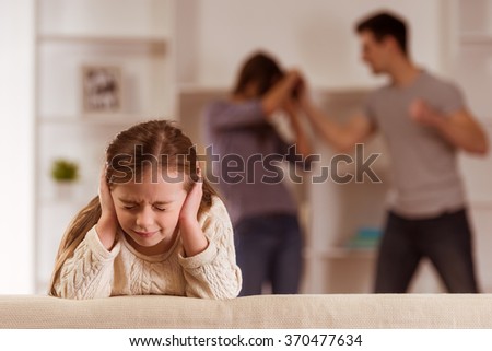 Ã�Â¡hild suffering from quarrels between parents in the family at home Royalty-Free Stock Photo #370477634