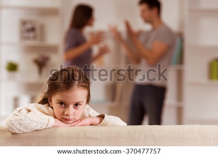 Ã�Â¡hild suffering from quarrels between parents in the family at home Royalty-Free Stock Photo #370477757