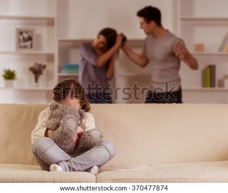 Ã�Â¡hild suffering from quarrels between parents in the family at home Royalty-Free Stock Photo #370477874