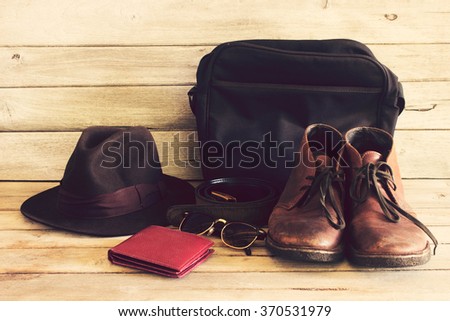 Vintage,Wallet,sunglasses,Hat,Belt,bag and leather shoes on wood background