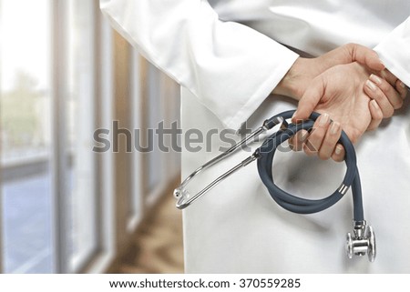 doctor in white uniform and big windows 