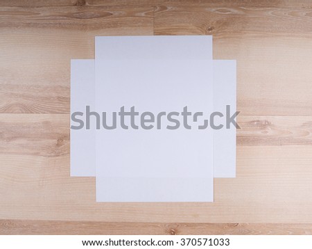 A4 paper on a wooden background