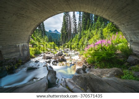 scene of water fall under the brick arch bridge in mt Rainier National Park,Washington,USA.