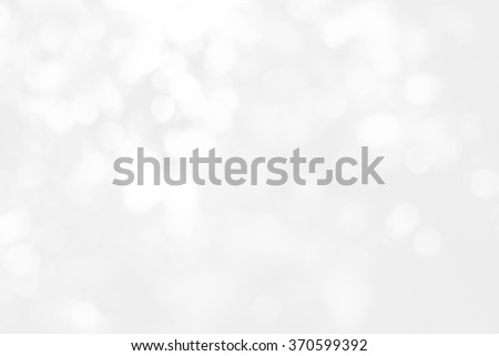 Artistic style - Defocused abstract white and gray bokeh lights background with blurring lights for your design