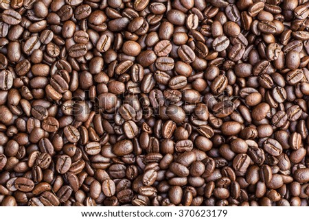 A coffee mug of coffee beans, can be used as a background