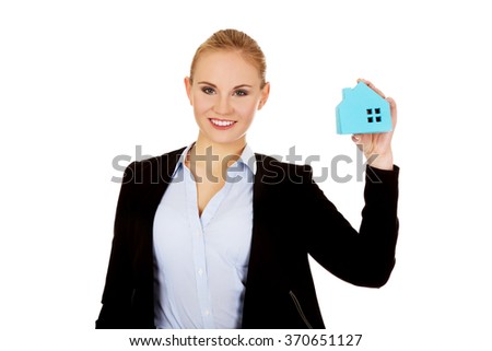 Smile business woman holding a paper house